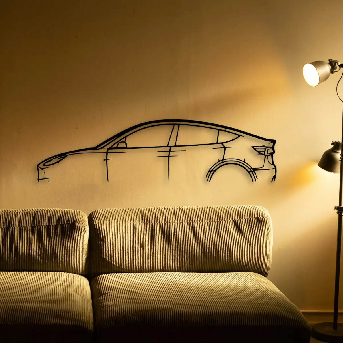 Tesla Model Y laser-cut metal silhouette edge detail
