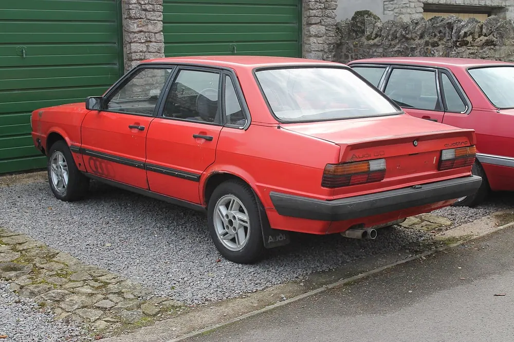 Audi 80 Quattro — cut-metal silhouette in clean-sided form