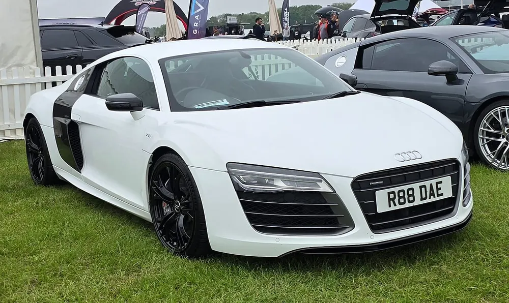 Audi R8 V10 Plus — cut-metal silhouette in clean-sided form