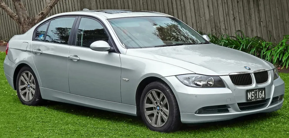 BMW E90 — cut-metal silhouette in clean-sided form