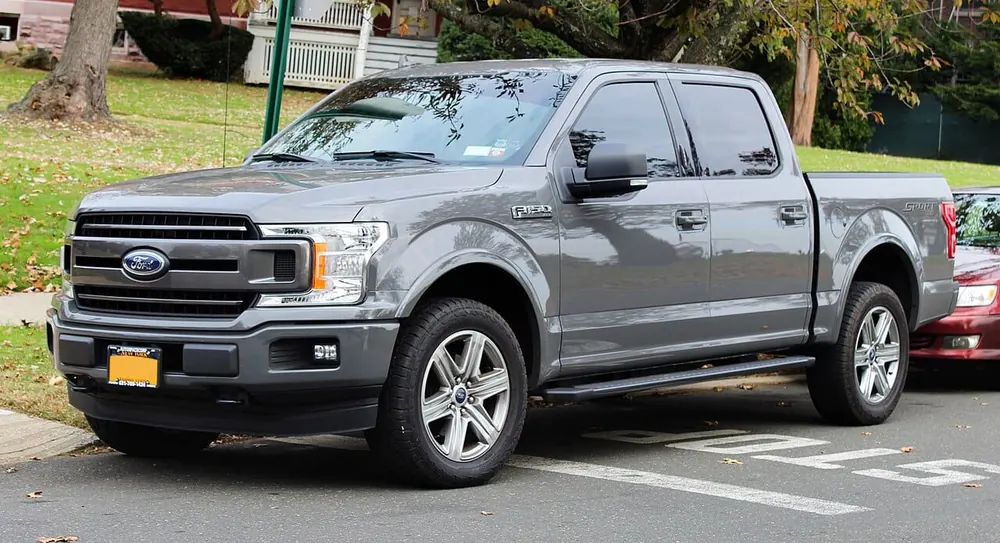 Ford F100 — cut-metal silhouette in clean-sided form