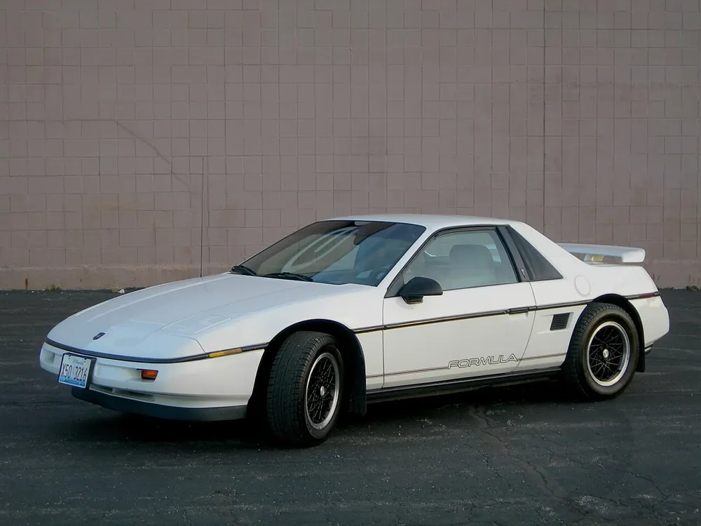 Pontiac Fiero GT — cut-metal silhouette in clean-sided form